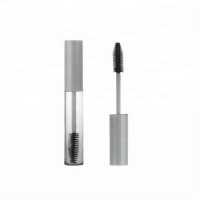 Empty round clear mascara packaging with brush